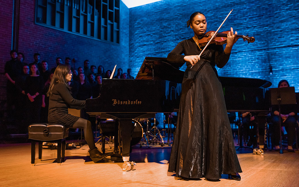Stanback performs violin at concert