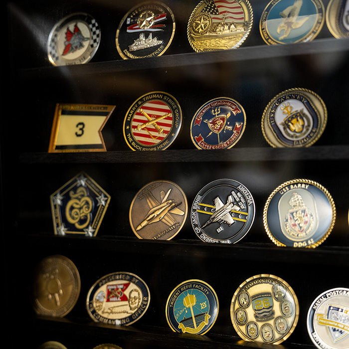 Collection of coins behind glasss