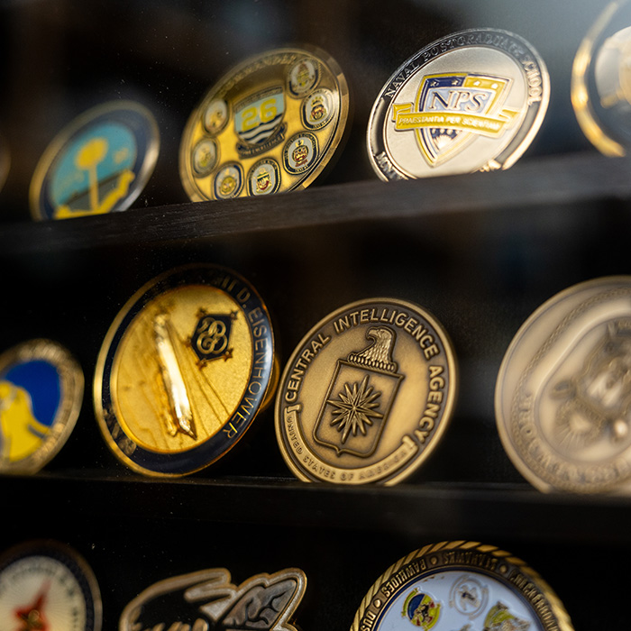 Collection of coins behind glasss