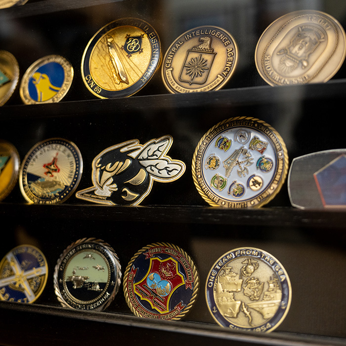 Collection of coins behind glasss