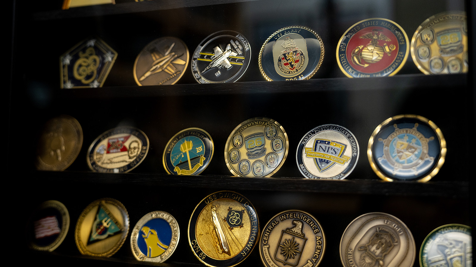 Collection of coins behind glasss