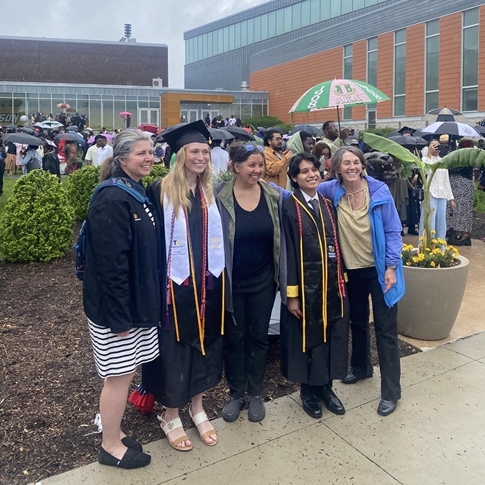 group of professors/students post-grad