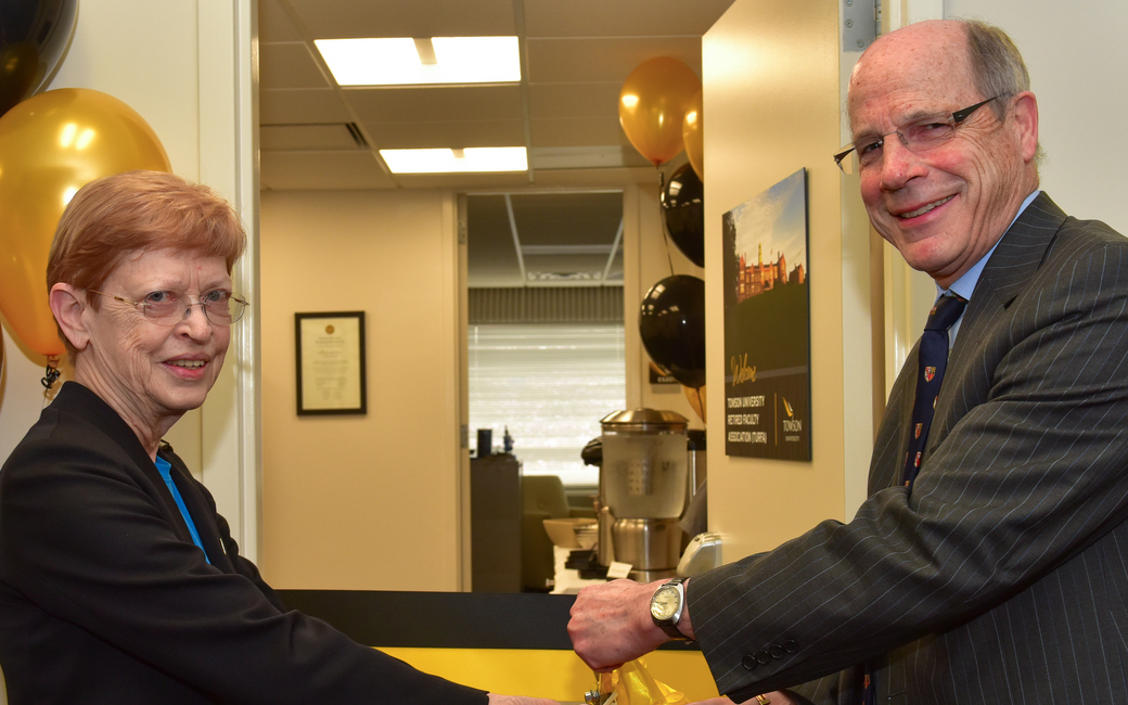 Annette Chappell, president of TURFA and Timothy J.L. Chandler, university provost, cut the ribbon at the opening of the TURFA office suite in Enrollment Services.