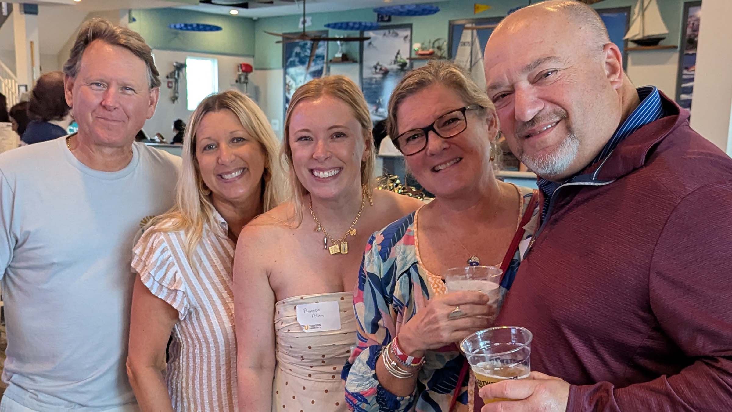 Mike Allen, Laura Allen, Amanda Allen ’14, Gabby Jacobson ’21 and Jonas Jacobson ’90 at Saltwater 75 happy hour
