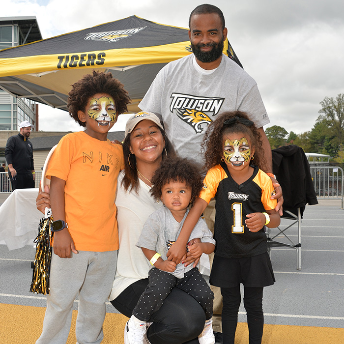 Families take advantage of activities like face painting and caricature drawings.