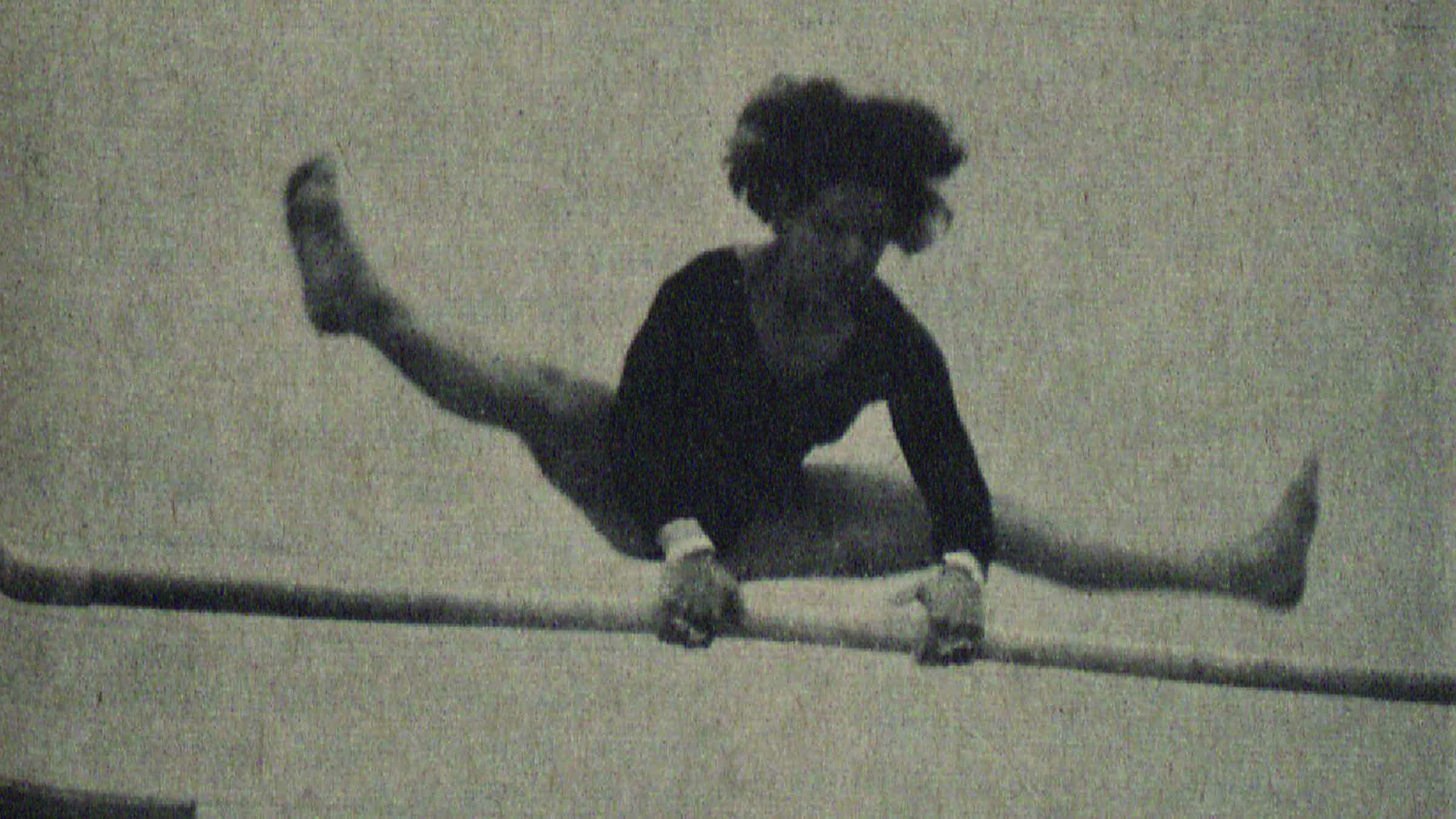 black and white photo of a TU gymnast