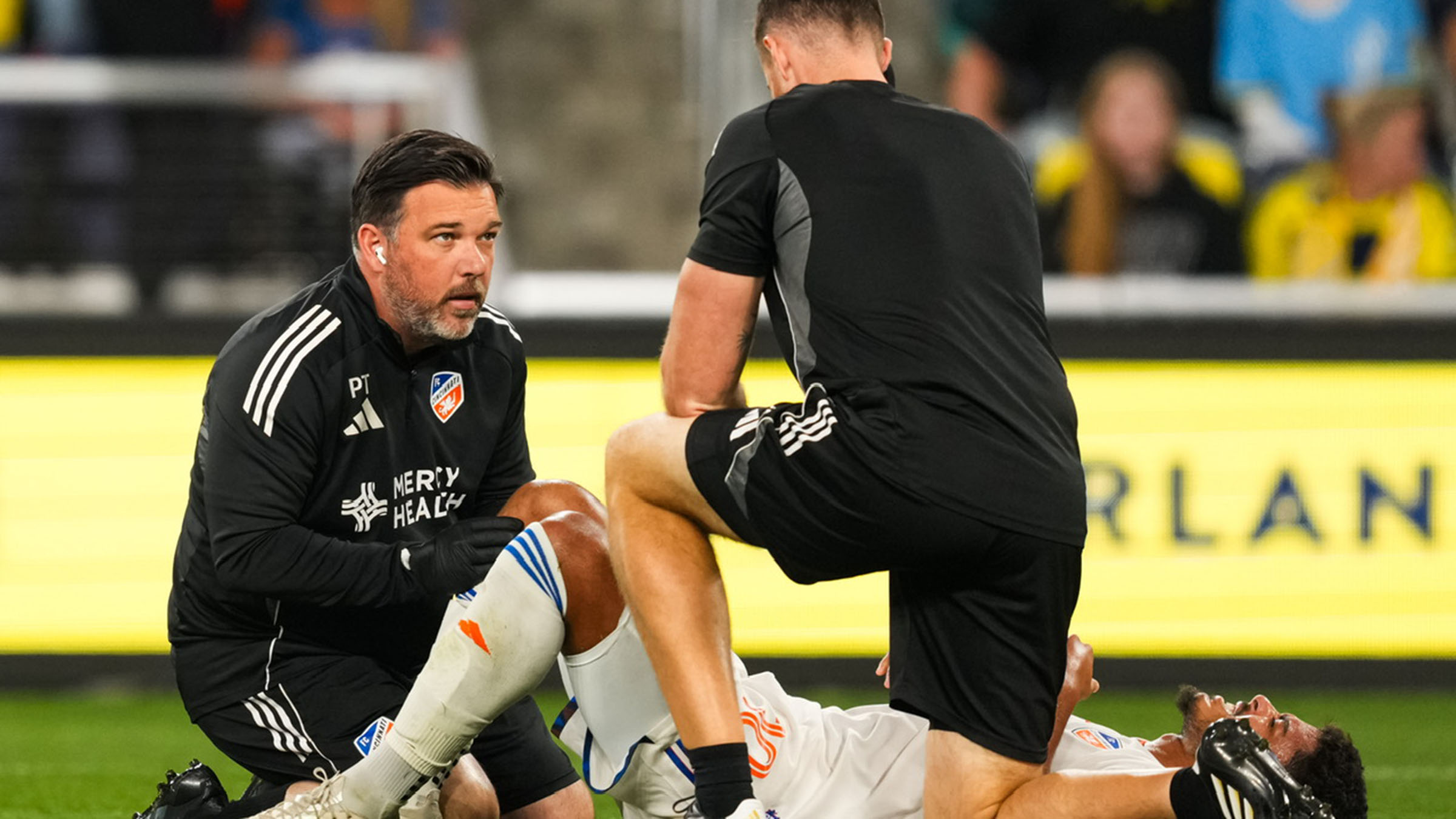 Patrick Tanner helps an injured player