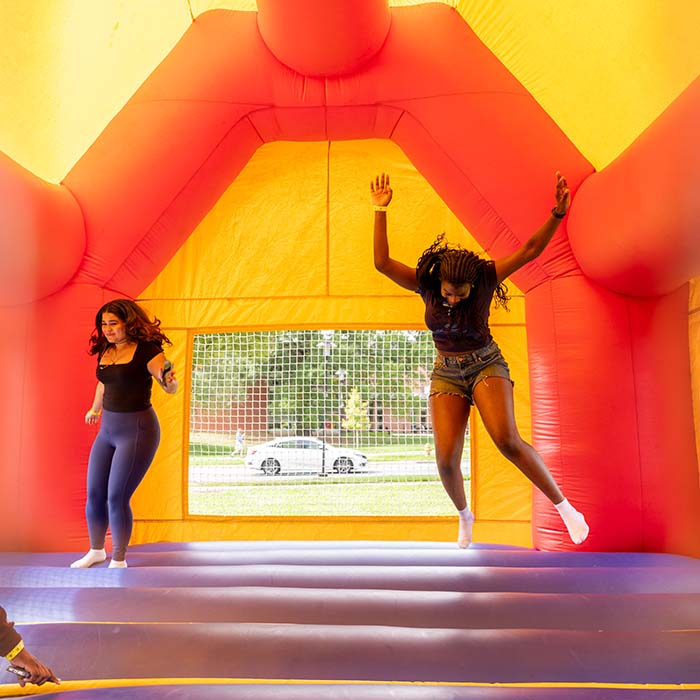 two girls in a bounce house