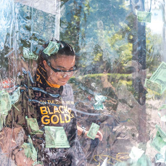 TU student playing a money grab game