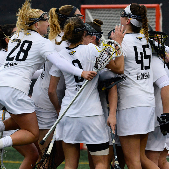 Women playing lacrosse