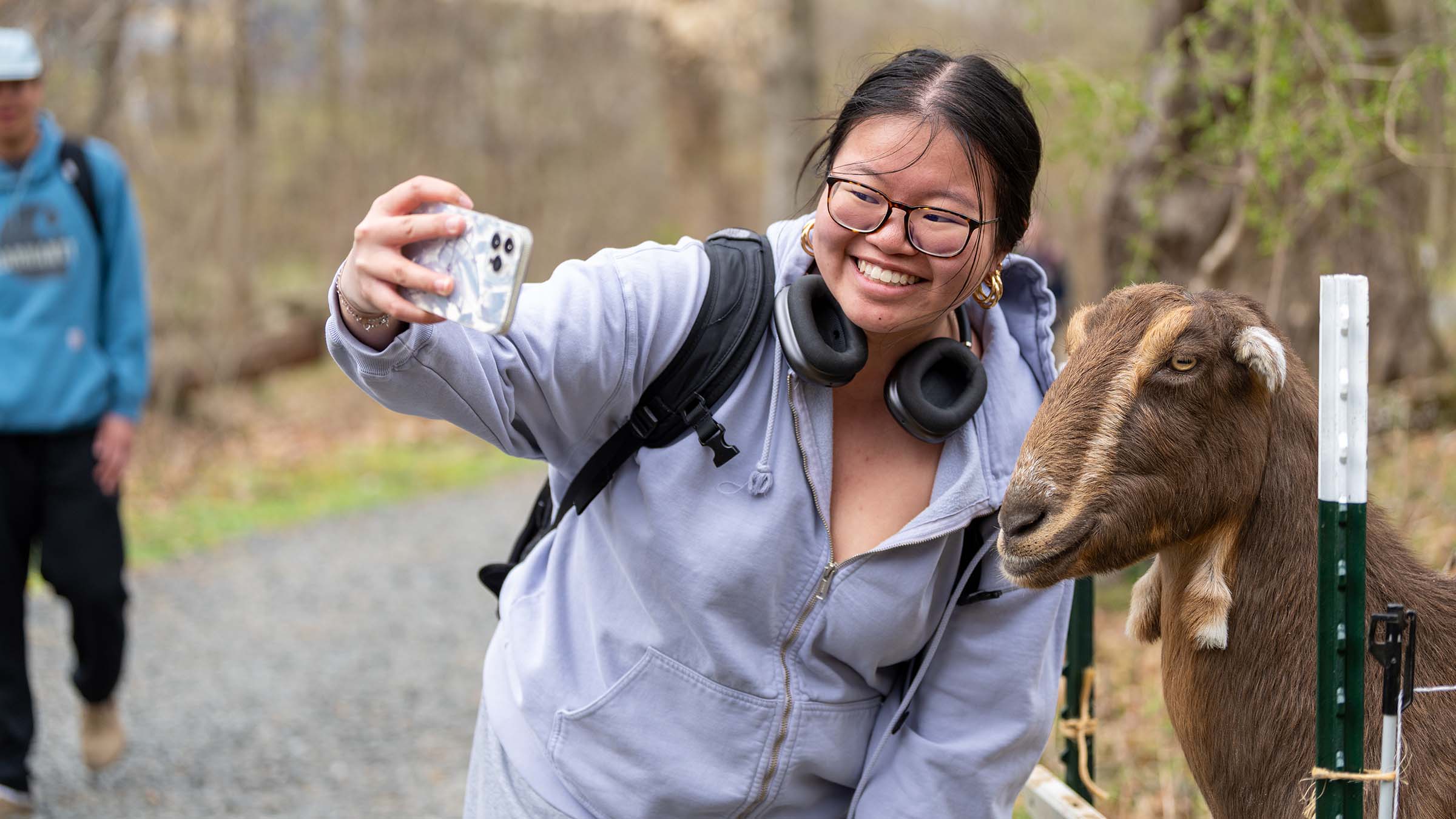 TU student posing with a goat