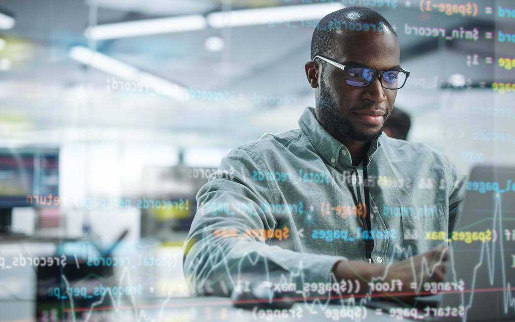 Cybersecurity professional working on a computer
