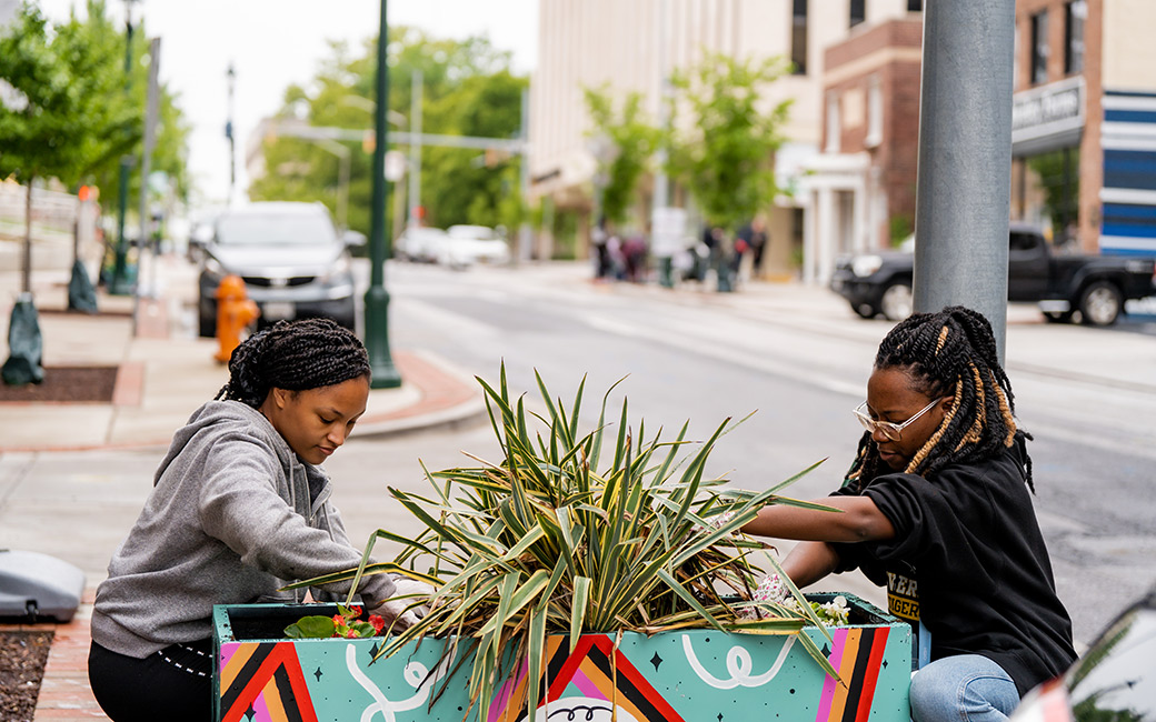 Students planting in a raised bed