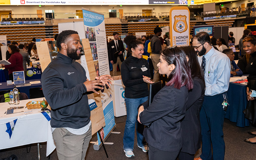 student and employer at a career fair