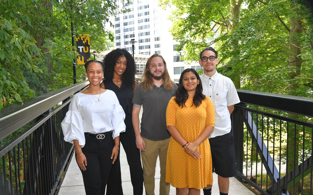 Group of TU students standing on bridge