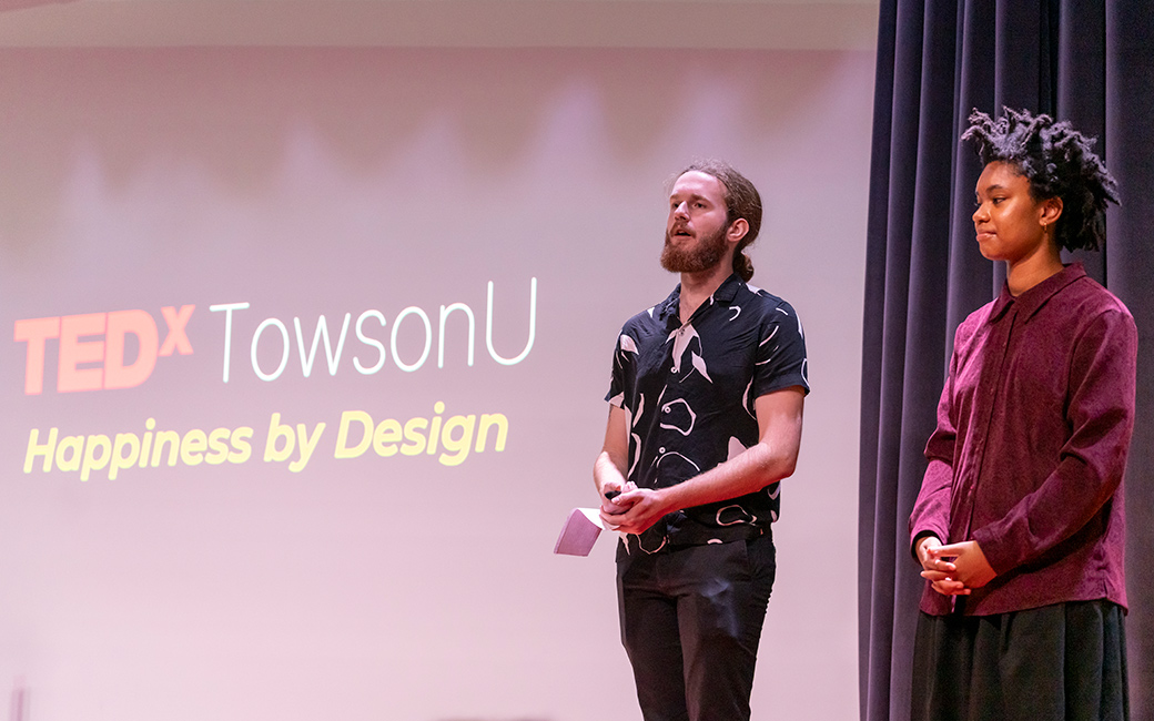 The TEDxTowsonU audience watches a talk.