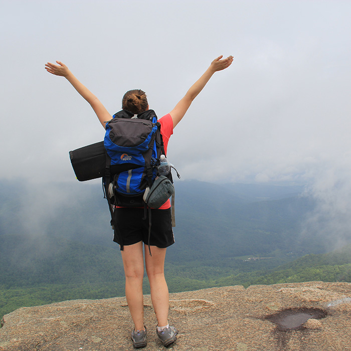 student hiking outdoors